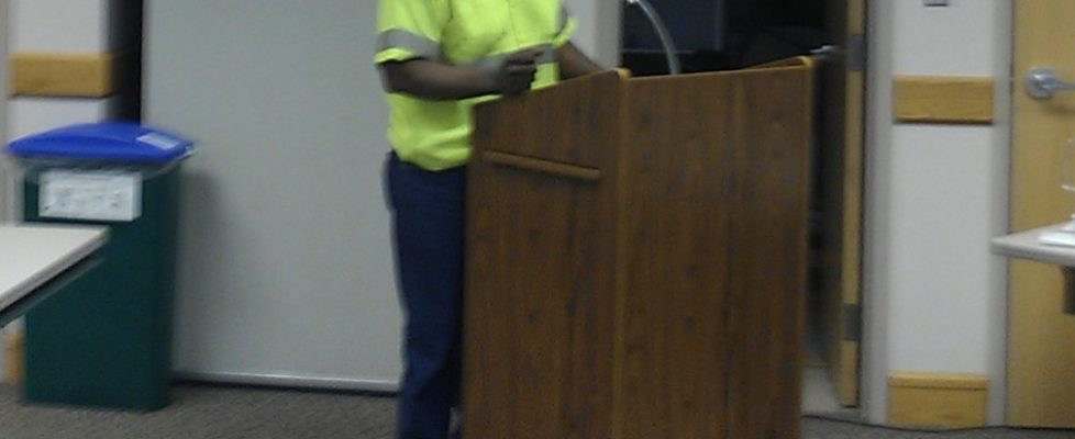 Milton Webb, a worker in the Tompkins County Solid Waste Division, but employed by subcontractor, ReCommunity Recycling, testifying before the County Living Wage Working Group. Webb, and Stanley McPherson, both make $9.00/hour employed by ReCommunity, which is significantly lower than the Living Wage in Tompkins County.