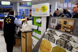 Talking briefly with Wal-Mart Store Manager, Floyd Bump, about the letter delivered on behalf of a community that wants economic justice for all its citizens. (Photo: Paul Gottleib)