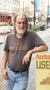 Joe Wetmore, Owner of Autumn Leaves Used Books outside the store on The Commons in Ithaca